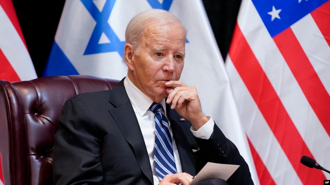 FILE - President Joe Biden listens as he and Israeli Prime Minister Benjamin Netanyahu participate in an expanded bilateral meeting with Israeli and U.S. government officials, Oct. 18, 2023, in Tel Aviv. 