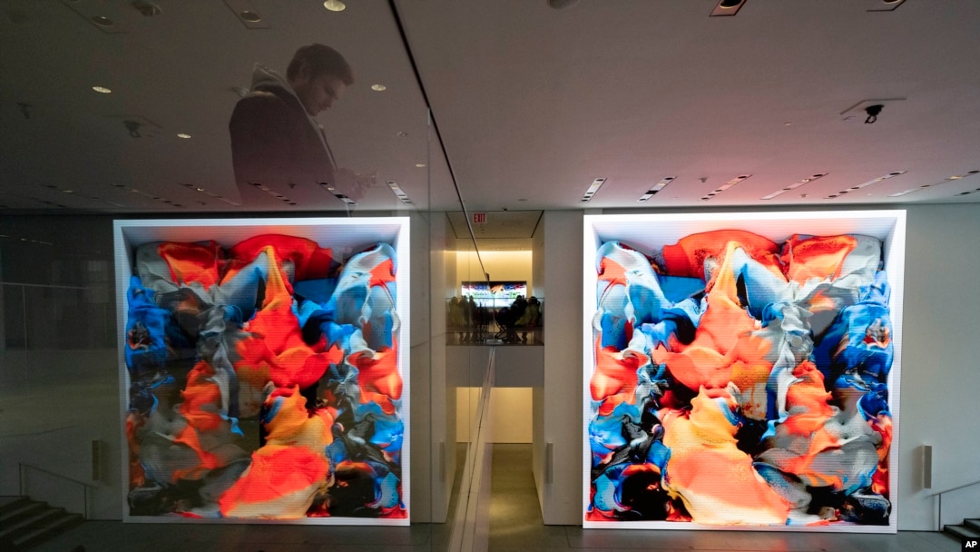 Visitors view artist Refik Anadol's "Unsupervised" exhibit at the Museum of Modern Art, Jan. 11, 2023, in New York. 