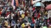 FILE - Shoppers crowd a market in Nigeria's commercial capital of Lagos, Aug. 15, 2019. Eight countries worldwide, including Nigeria, are expected to account for more than half of the global population growth over the next three decades. 