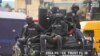 FILE - Police officers patrol during a protest on the street in Lagos, Nigeria, July 26, 2022. Demonstrators took to the streets in Nigeria's central Niger state on Jan. 17, 2023, to protest the killing of a Catholic priest. 