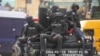 Police officers patrol during a protest by Nigeria Labour Congress on the street in Lagos, Nigeria, Tuesday, July 26, 2022. More police have been deployed to the capital of Abuja after attacks last week on presidential guards and at a military checkpoint.