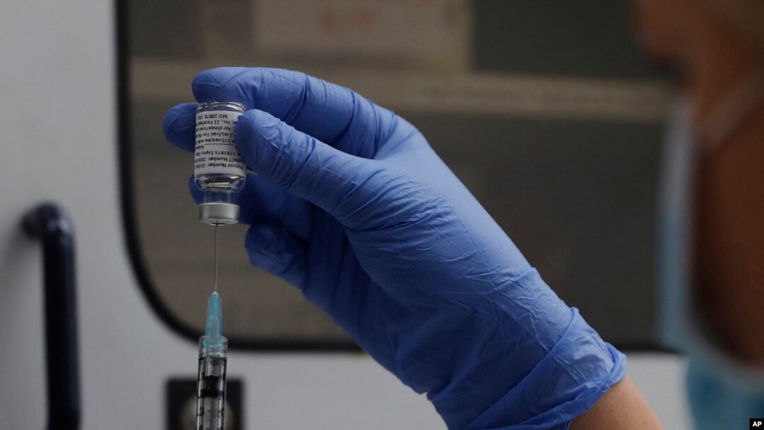 FILE - A vial of the Phase 3 Novavax coronavirus vaccine is seen ready for use in the trial at St. George's University hospital in London, Oct. 7, 2020. 