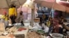 FILE - Vendors are seen with their goods at Mvog Ada market in Yaounde, Cameroon, Jan. 29, 2022. 