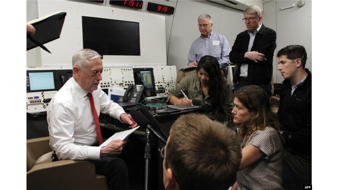 Defense Secretary Jim Mattis speaks to reporters aboard a US military plane on May 29, 2018, as he flies to Hawaii.
