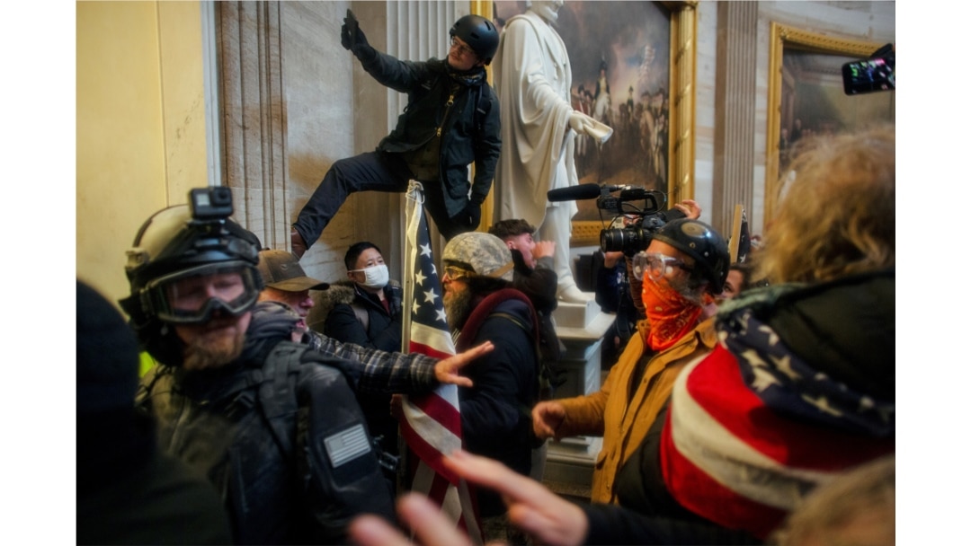 FILE - Pro-Trump protesters storm the U.S. Capitol to contest the certification of the 2020 U.S. presidential election results by the U.S. Congress, at the U.S. Capitol in Washington, Jan. 6, 2021.