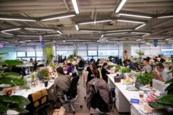 Employees work at an office at the headquarters of Ant Group, an affiliate of Alibaba, in Hangzhou, Zhejiang province, China, Oct. 29, 2020.
