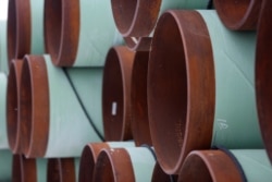 FILE - A depot used to store pipes for Transcanada Corp's planned Keystone XL oil pipeline is seen in Gascoyne, North Dakota, Jan. 25, 2017.