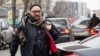 FILE - Russian theater and film director Kirill Serebrennikov walks to a court hearing in Moscow, April 12, 2019. A Moscow court dismissed the case against an acclaimed director, two years after he was accused of embezzlement and put under house arrest.