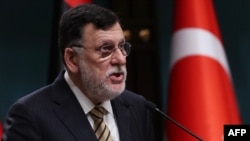 FILE - Libyan Prime Minister Fayez al-Sarraj holds a joint press conference at the Presidential Complex in Ankara, June 4, 2020.