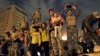 Egyptian Army soldiers celebrate with children on their armored personnel carrier, as they celebrate the news of the resignation of President Hosni Mubarak, Feb. 11, 2011