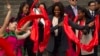 U.S. first lady Michelle Obama dances with performers with her daughters Malia, second from left, and Sasha, right, in China's Shaanxi province, March 24, 2014.
