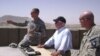 Secretary Gates receives a briefing from officers at Combat Outpost Senjaray, Afghanistan