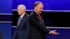 Republican vice-presidential nominee Gov. Mike Pence and Democratic vice-presidential nominee Sen. Tim Kaine, right, walk past each other after the vice-presidential debate at Longwood University in Farmville, Va., Tuesday, Oct. 4, 2016.
