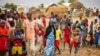 FILE - Refugees are seen gathered at Minawao Refugee Camp in northern Cameroon, Apr. 18, 2016. 