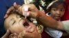FILE - An Indonesian boy is given polio vaccine in Jakarta, Indonesia, Nov. 30, 2005.