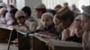 Pakistani children attend lessons at a madrassa, or a religious school, to learn Quran, in Karachi, Sept. 2, 2015. 