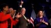 House Minority Leader Nancy Pelosi of Calif., right, steps away from the podium as House Minority Whip Steny Hoyer, D-Md., makes