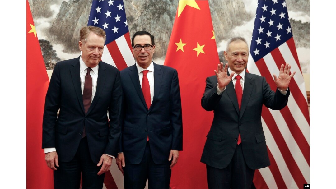 Chinese Vice Premier Liu He, right, gestures as U.S. Treasury Secretary Steven Mnuchin, center, chats with his Trade Representative Robert Lighthizer, left, before they proceed to their meeting at the Diaoyutai State Guesthouse in Beijing, May 1, 2019.