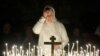 FILE - A believer prays in a church in Moscow, Russia, Jan. 6, 2010.