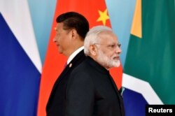 Çin Cumhurbaşkanı Xi Jinping ve Hindistan Başbakanı Narendra Modi, 4 Eylül 2017.