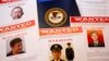 Press materials are displayed on a table of the Justice Department in Washington, May 19, 2014, before Attorney General Eric Holder was to speak at a news conference. 