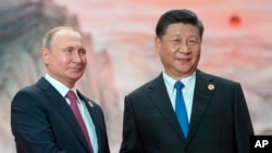 中国国家主席习近平与俄罗斯总统普京在上合组织峰会合影 