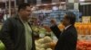 Todos Supermarket founder and CEO Carlos Castro, right, says Hispanic political clout is growing in Prince William County, February 2016. (S. Baragona/VOA) 