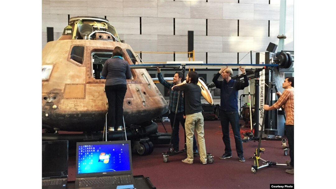 Specialists using special 3-D technology to scan the interior of the Apollo 11 Command Module, (National Air and Space Museum).