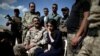 Yazidi survivor and U.N. Goodwill Ambassador for the Dignity of Survivors of Human trafficking Nadia Murad, center, visits her village for the first time after being captured and sold as a slave by the Islamic State three years ago, in Kojo, Iraq, June 1, 2017.