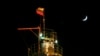 FILE - A Russian national flag flies on the top of a diesel plant in the Yarakta Oil Field, Irkutsk Region, Russia, March 10, 2019.