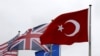FILE - A Turkish flag (R) flies among others flags of NATO members during a North Atlantic Council meeting alliance headquarters in Brussels, Belgium, July 28, 2015.