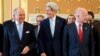 French Foreign Minister Laurent Fabius (L) talks with U.S. Secretary of State John Kerry, and British Foreign Secretary William Hague as they gather for a group photo of the London 11 at the Foreign Office in London, May 15, 2014.