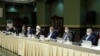 Senior officials wear face masks amid fears of COVID-19 as they attend a meeting of the Iranian government task force on the coronavirus, in Tehran, Iran, March 21, 2020.