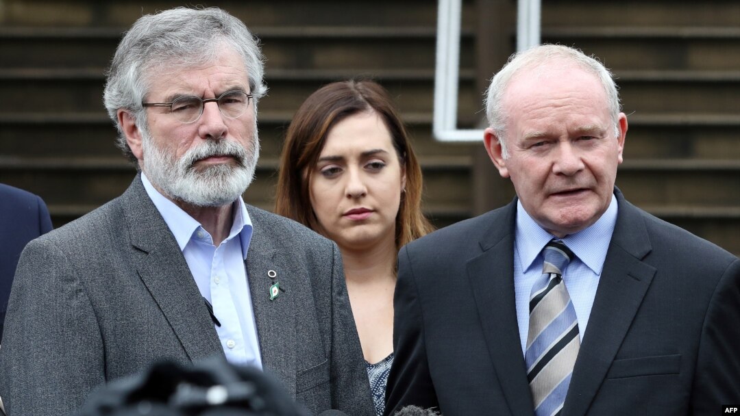 Sinn Fein leader Gerry Adams (L) and Sinn Fein politician and Northern Ireland's Deputy First Minister, Martin Mcguinness (R) speak during a press conference outside Stormont Castle in Belfast, Northern Ireland on June 24, 2016, following the result of the United Kingdom's June 23 referendum on whether or not to leave, or remain in the European Union (EU).