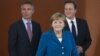 German Chancellor Angela Merkel, center, British PM David Cameron, right, and Norway's PM Jens Stoltenberg, left, arrive for a panel discussion in Berlin, Germany, June 7, 2012.
