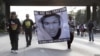 FILE - Demonstrators block traffic on a highway in Los Angeles as they protest the acquittal of George Zimmerman in the Trayvon Martin trial.