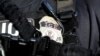 FILE - A U.S. Immigration and Customs Enforcement badge.