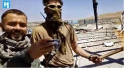 A screengrab from video published by Novaya Gazeta purports to show Stanislav D as the man on the left.