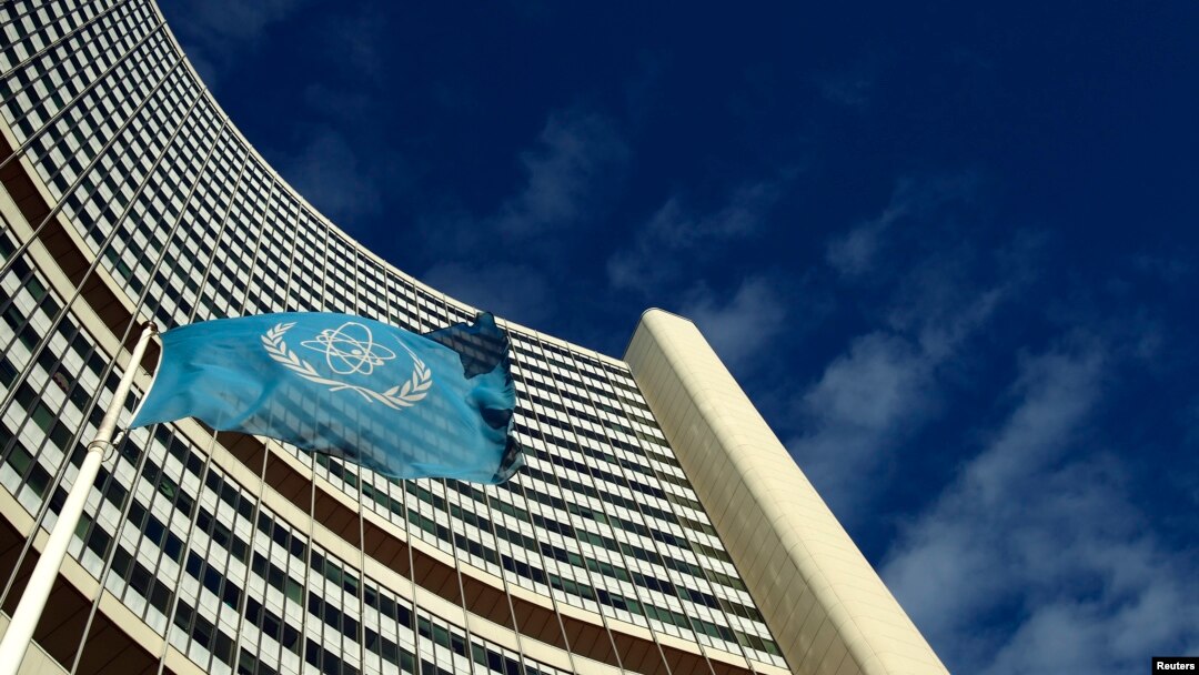 FILE - The flag of the International Atomic Energy Agency (IAEA) flies in front of its headquarters in Vienna, Austria.