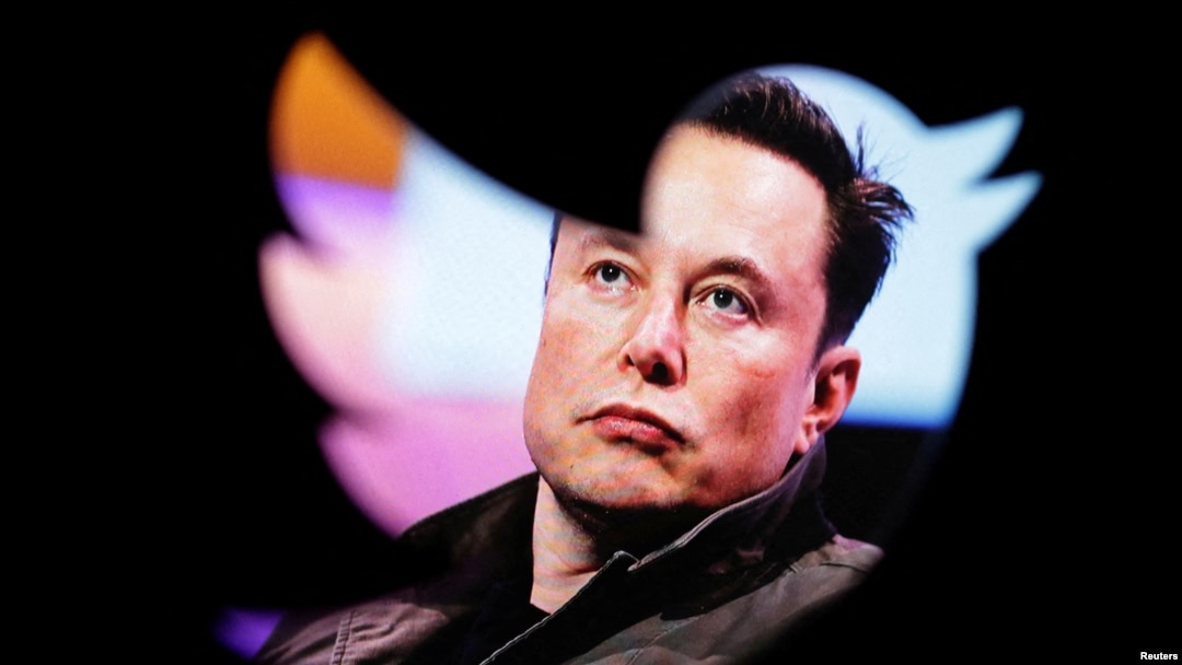 FILE PHOTO: Illustration shows Elon Musk's photo and Twitter logo