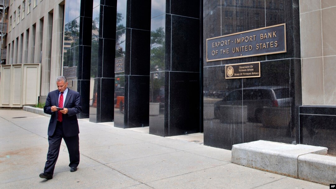 FILE - A man walks out of the Export-Import Bank of the U.S. in Washington.
