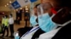 Health workers waits to screen travellers for signs of the coronavirus at the Kotoka International Airport in Accra, Ghana January 30, 2020.