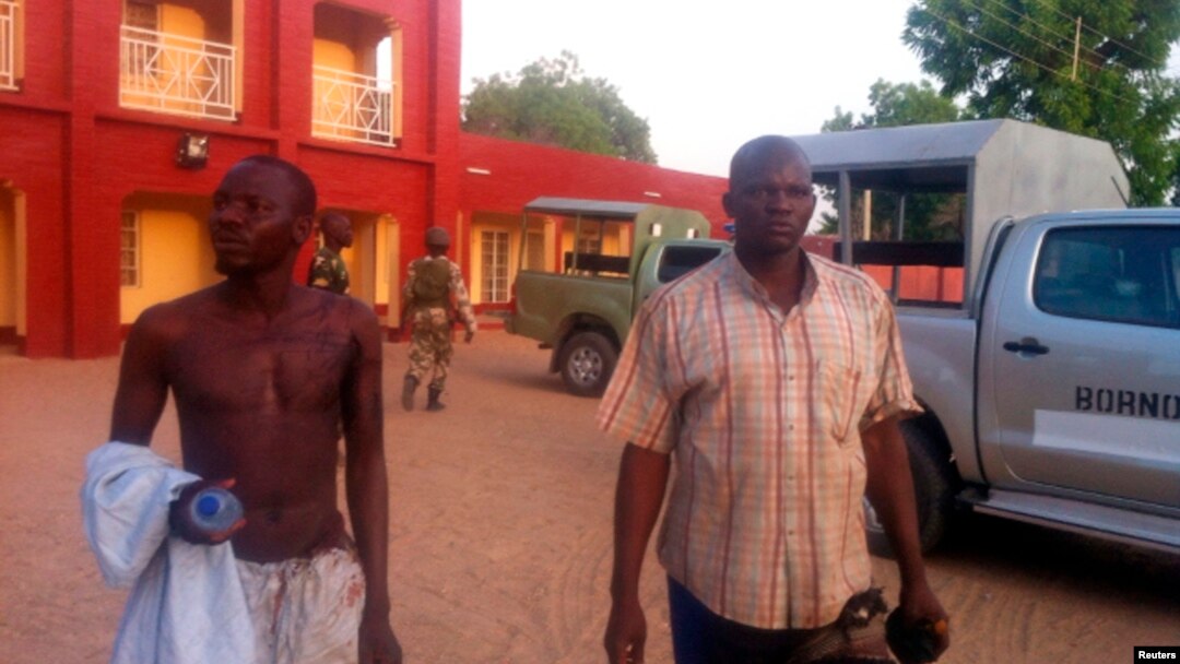 Injured policemen are seen outside Shehu's Palace of Bama, Borno State, Nigeria. May 7, 2013.