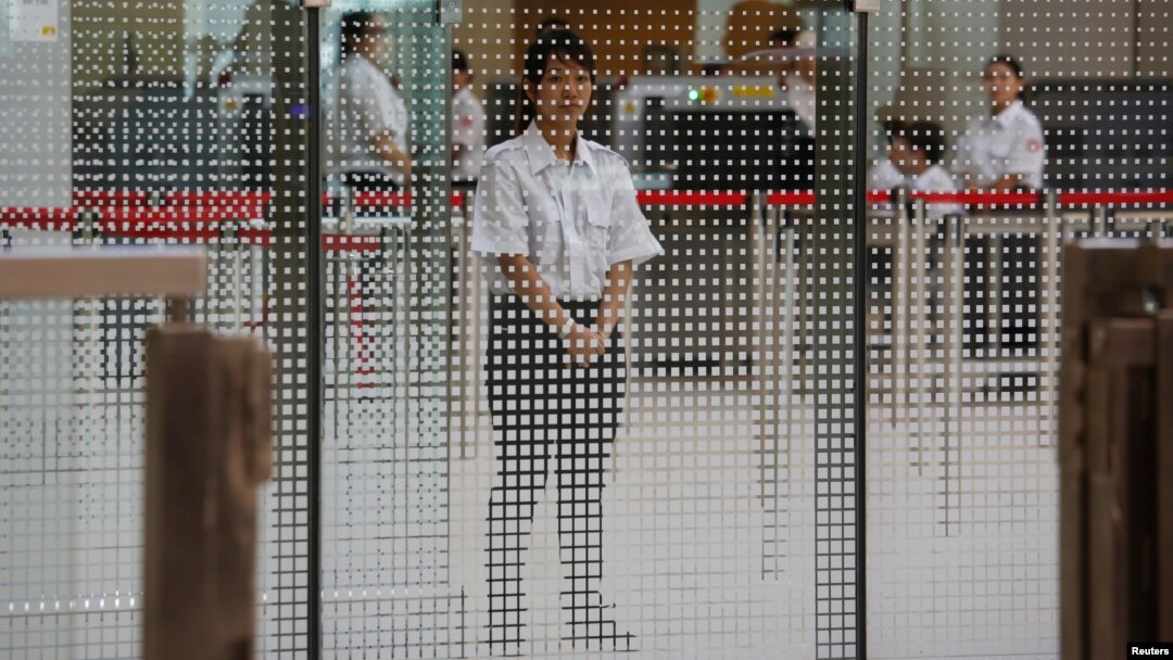 A demonstration of a security check for the Guangzhou-Shenzhen-Hong Kong Express Rail Link is performed at the West Kowloon Terminus, in Hong Kong, July 26, 2018.