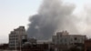 FILE - Smoke rises after Saudi-led coalition airstrikes on a target in Sanaa, Yemen, March 7, 2021. The coalition has launched a new air campaign on the war-torn country’s capital and on other provinces. 