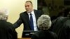 Kosovo's former Prime Minister and former commander of the Kosovo Liberation Army Ramush Haradinaj smiles during the verdict reading in his retrial at the International Criminal Tribunal for the former Yugoslavia in The Hague November 29, 2012.