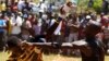 FILE - Fist fighters battle during the Musangwe, an age old tradition where men and boys display their fighting skills, at Gaba Village in Limpopo province, South Africa. 