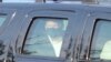 President Donald Trump drives past supporters gathered outside Walter Reed National Military Medical Center in Bethesda, Md., Oct. 4, 2020.