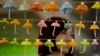 A woman poses for a photo with the paper fold umbrellas at the occupied area in Causeway Bay, a shopping district of Hong Kong, Oct. 21, 2014. 