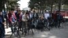 FILE - Journalists gather for a news event at Shahr-e-Naw Park in Kabul, Afghanistan, April 30, 2019.
